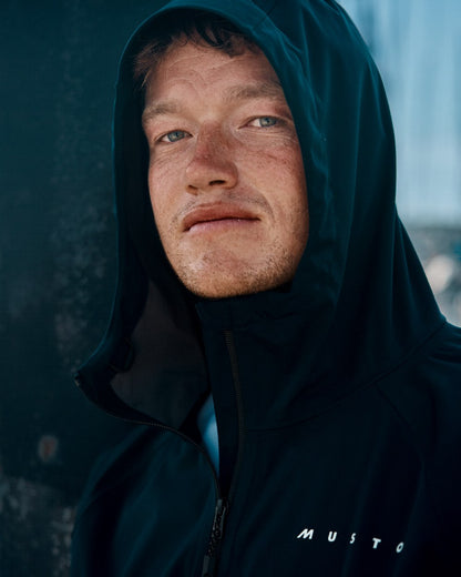 Navy Coloured Musto Mens Venture 3L Jacket on Blurry Background
