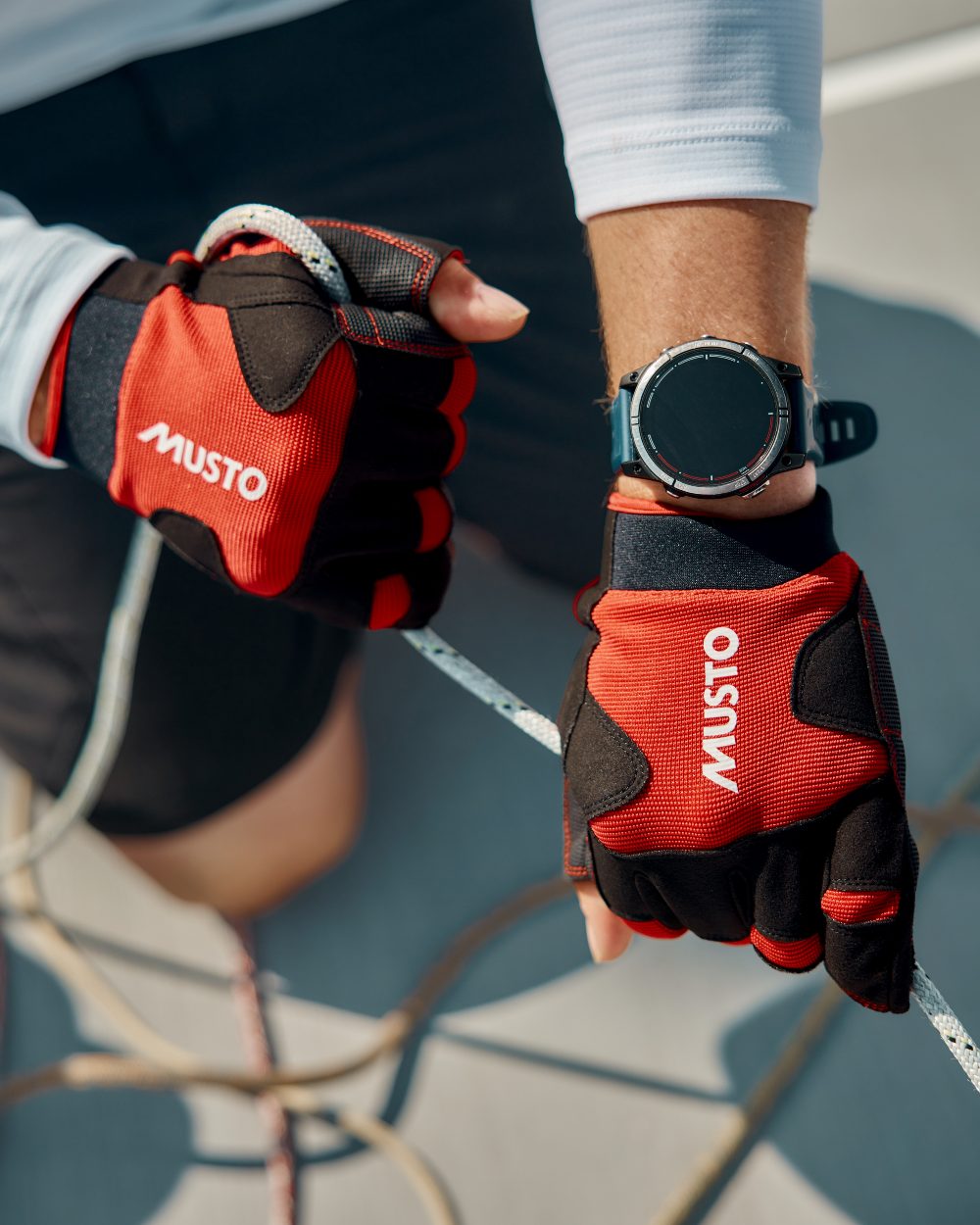 True Red Coloured Musto Performance Short Finger Glove 2.0 on Blurry Background

