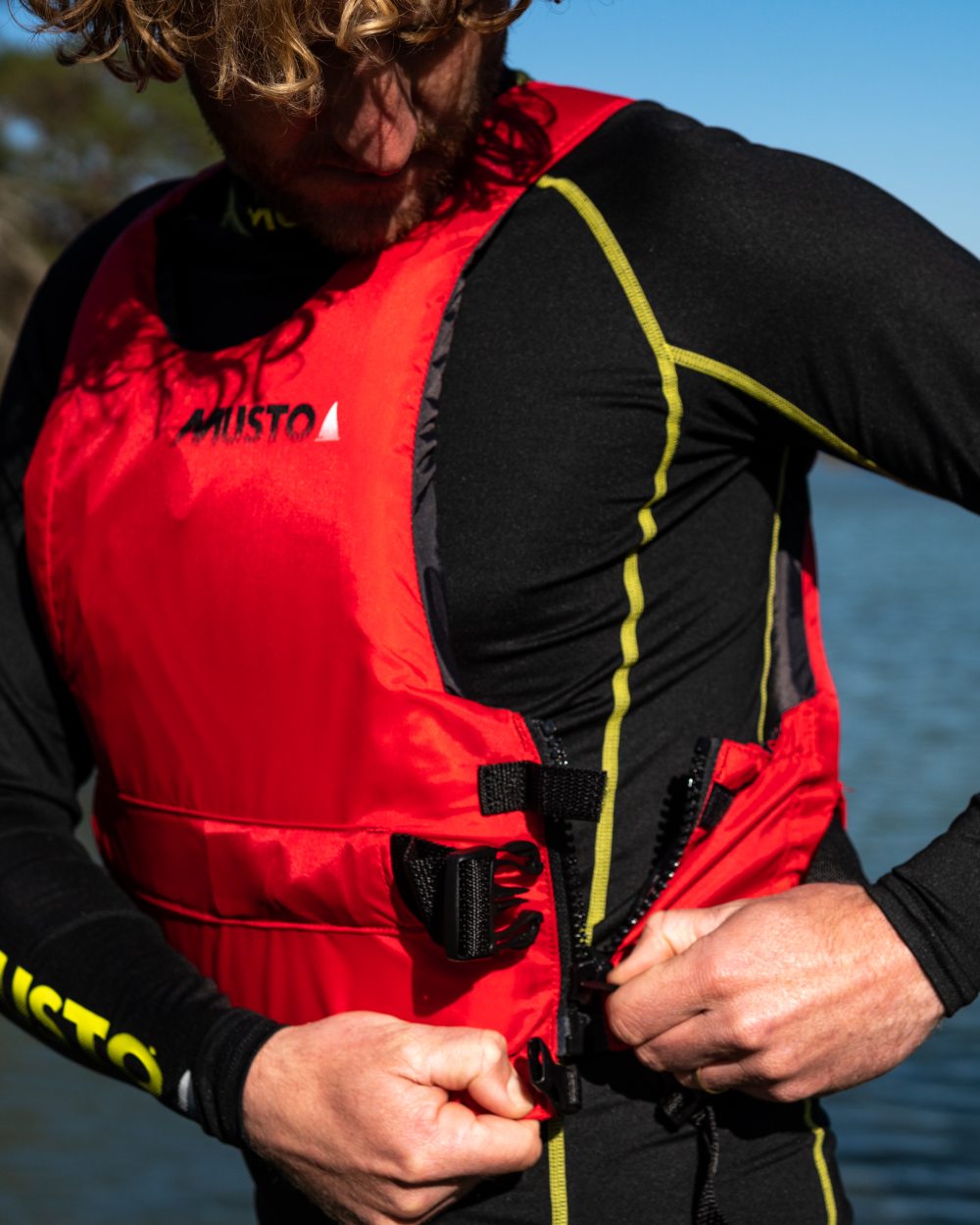 True Red Coloured Musto Regatta Buoyancy Aid On A White Background