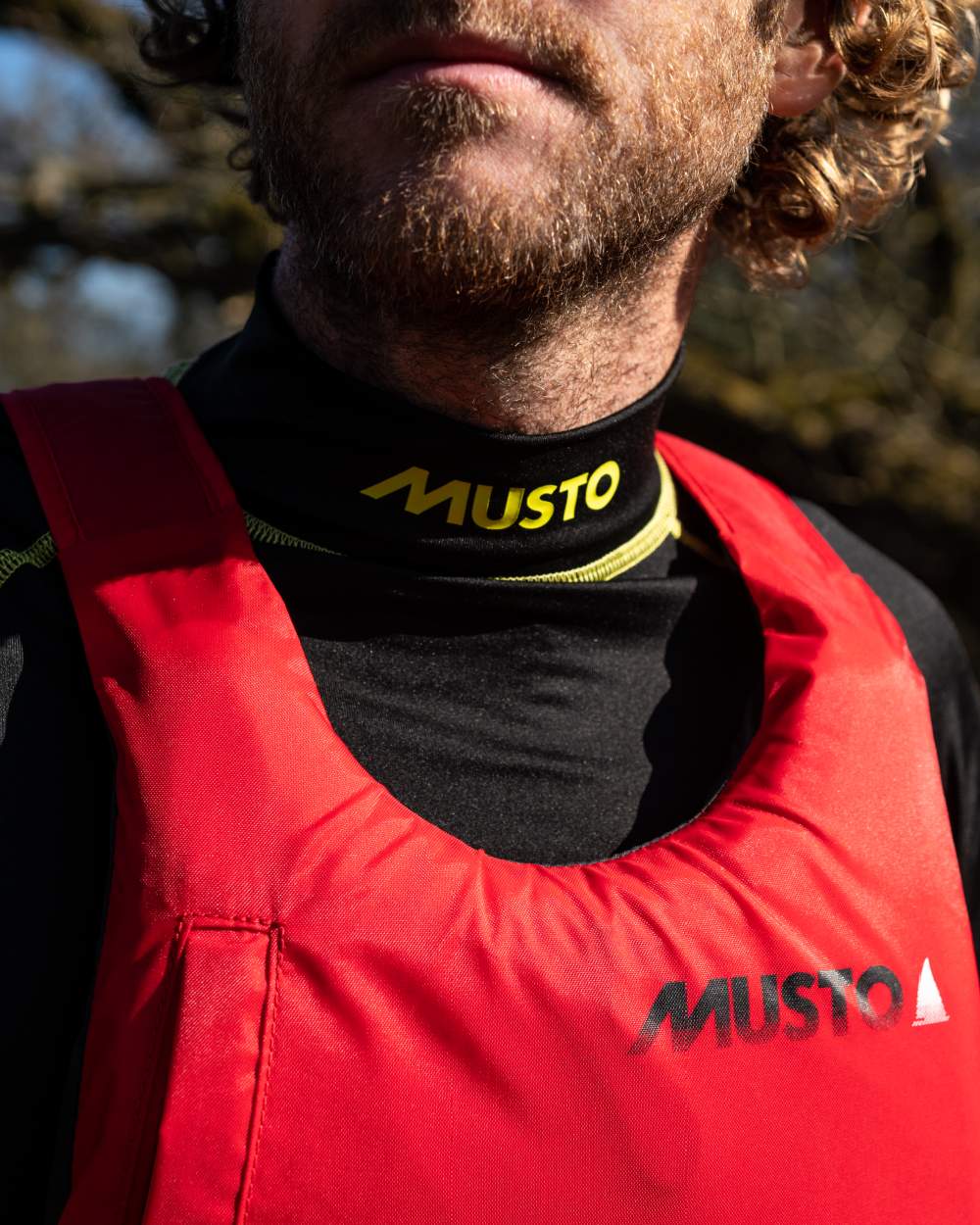 True Red Coloured Musto Regatta Buoyancy Aid On A White Background