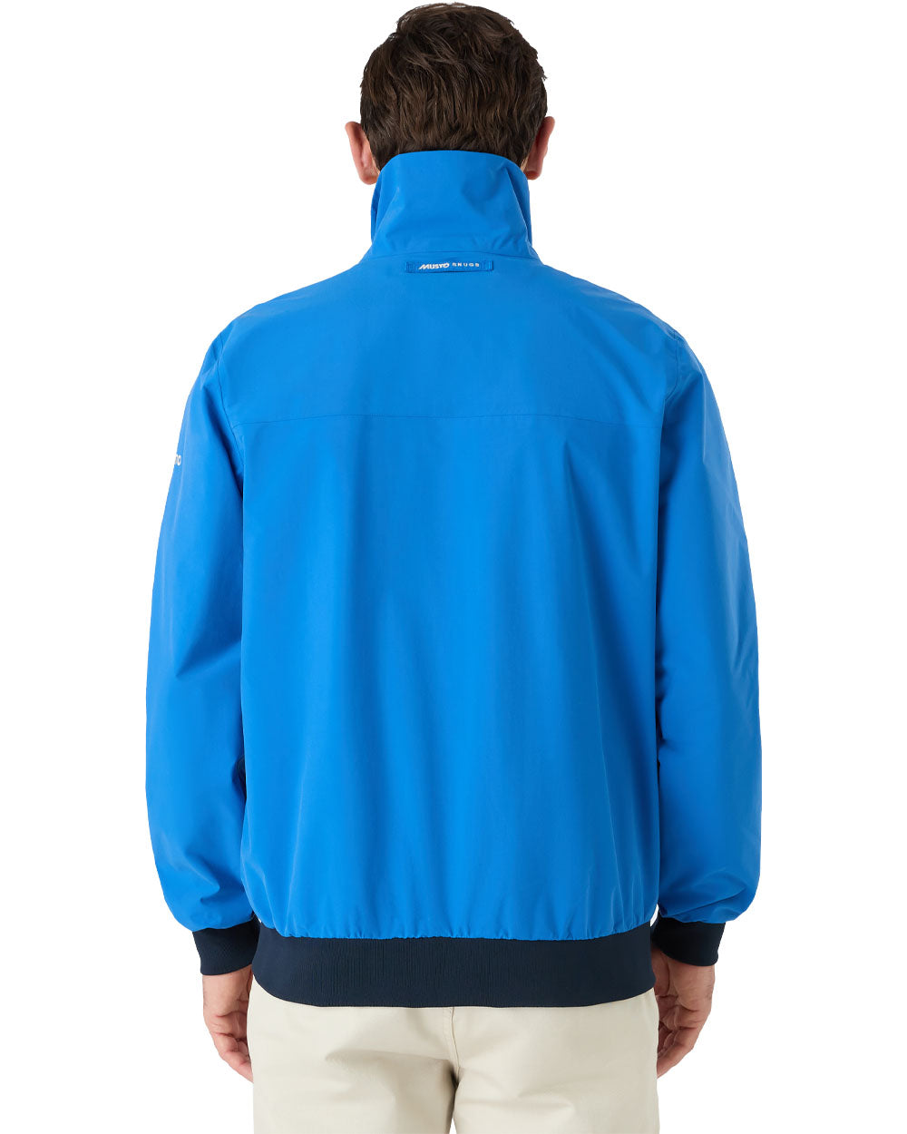 Aruba Blue coloured Musto Snug Blouson Jacket on White background 