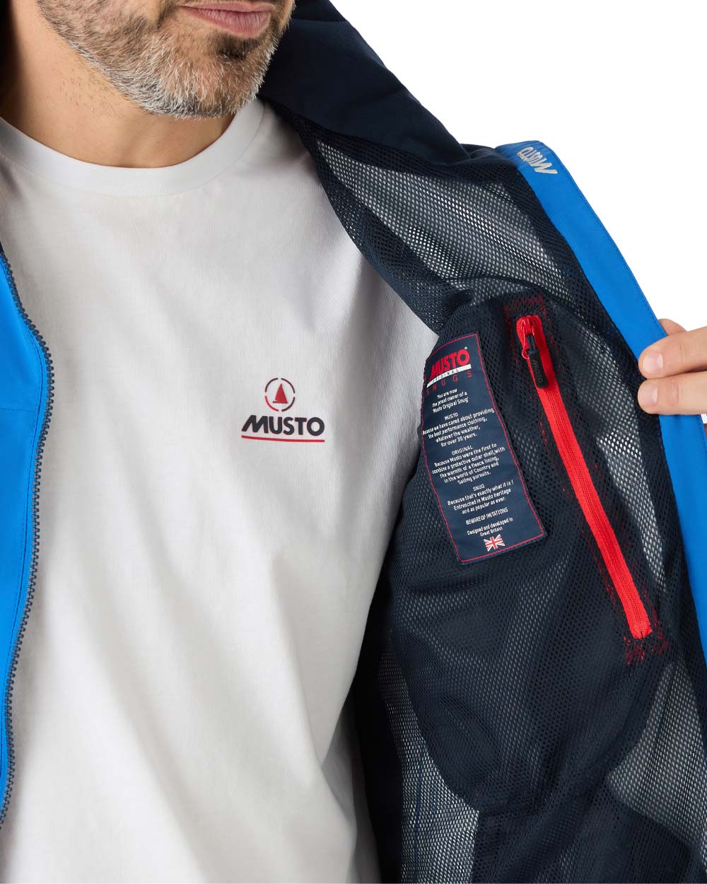 Aruba Blue coloured Musto Snug Blouson Jacket on White background 