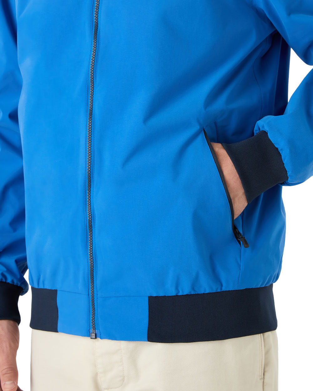 Aruba Blue coloured Musto Snug Blouson Jacket on White background 