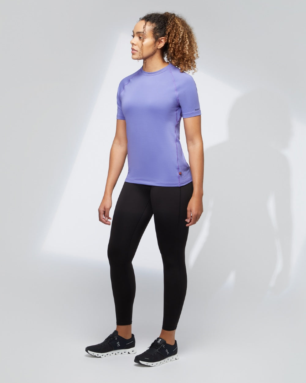 Black coloured Musto Womens Evolution Active Leggings on grey background 