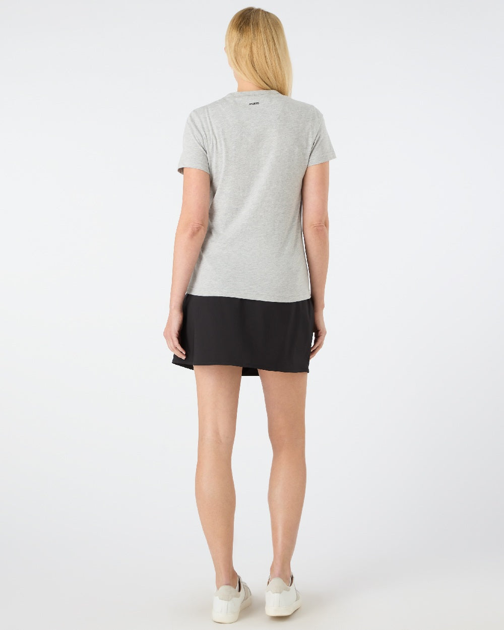 Black coloured Musto Womens Fast Dry Skorts on grey background 