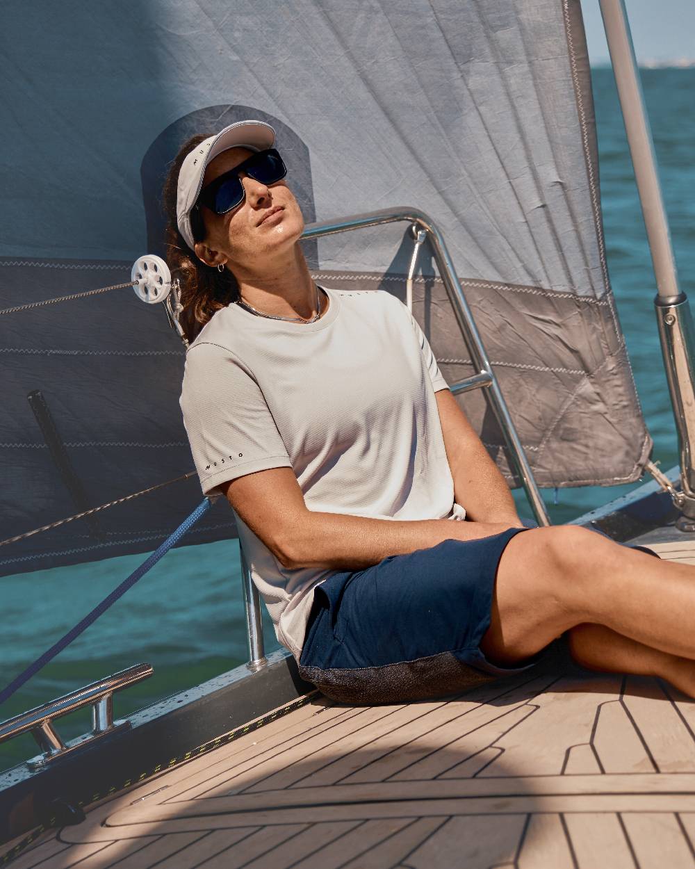 True Navy Coloured Musto Womens Performance Stretch Shorts on Boat Background
