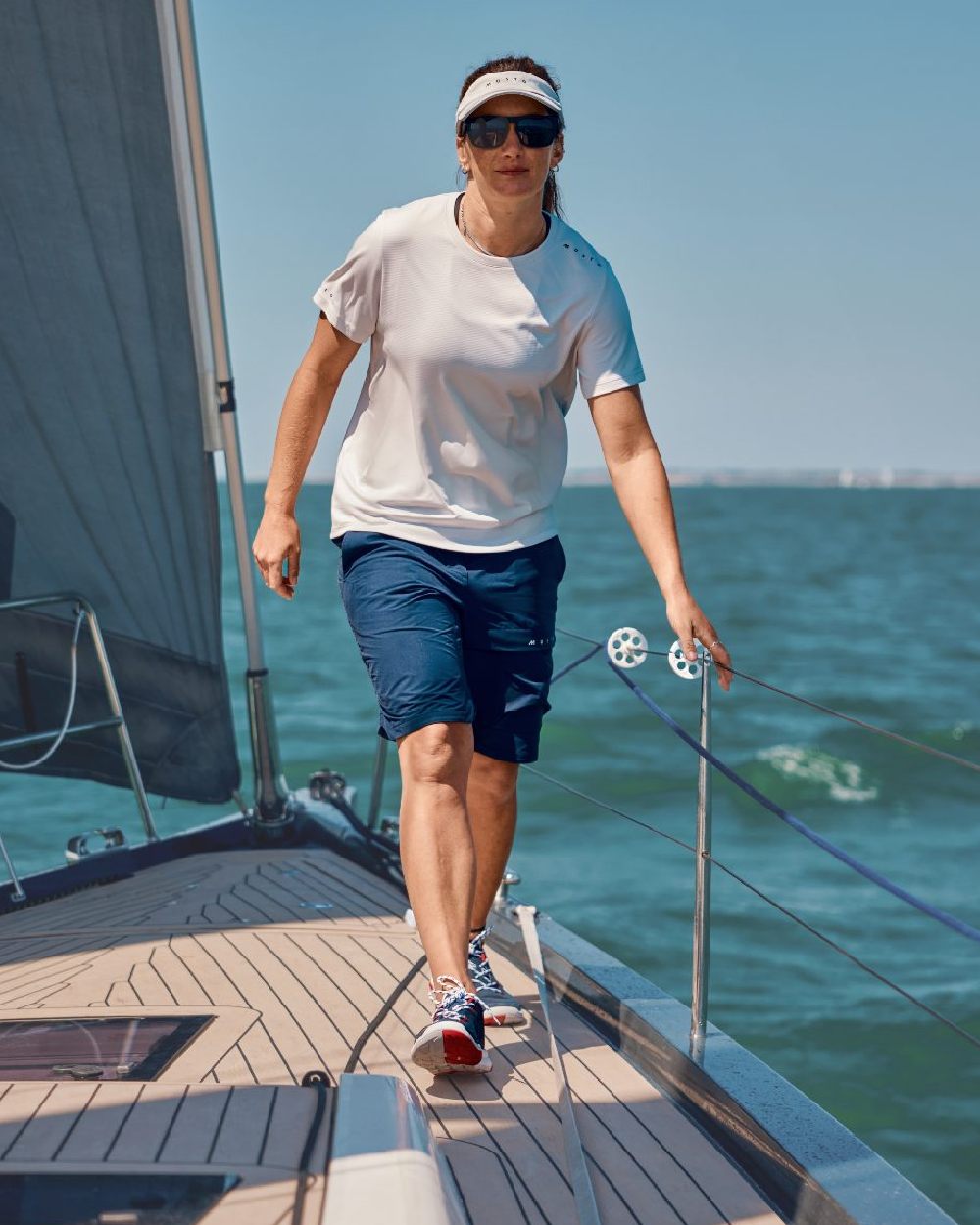 True Navy Coloured Musto Womens Performance Stretch Shorts on Boat Background
