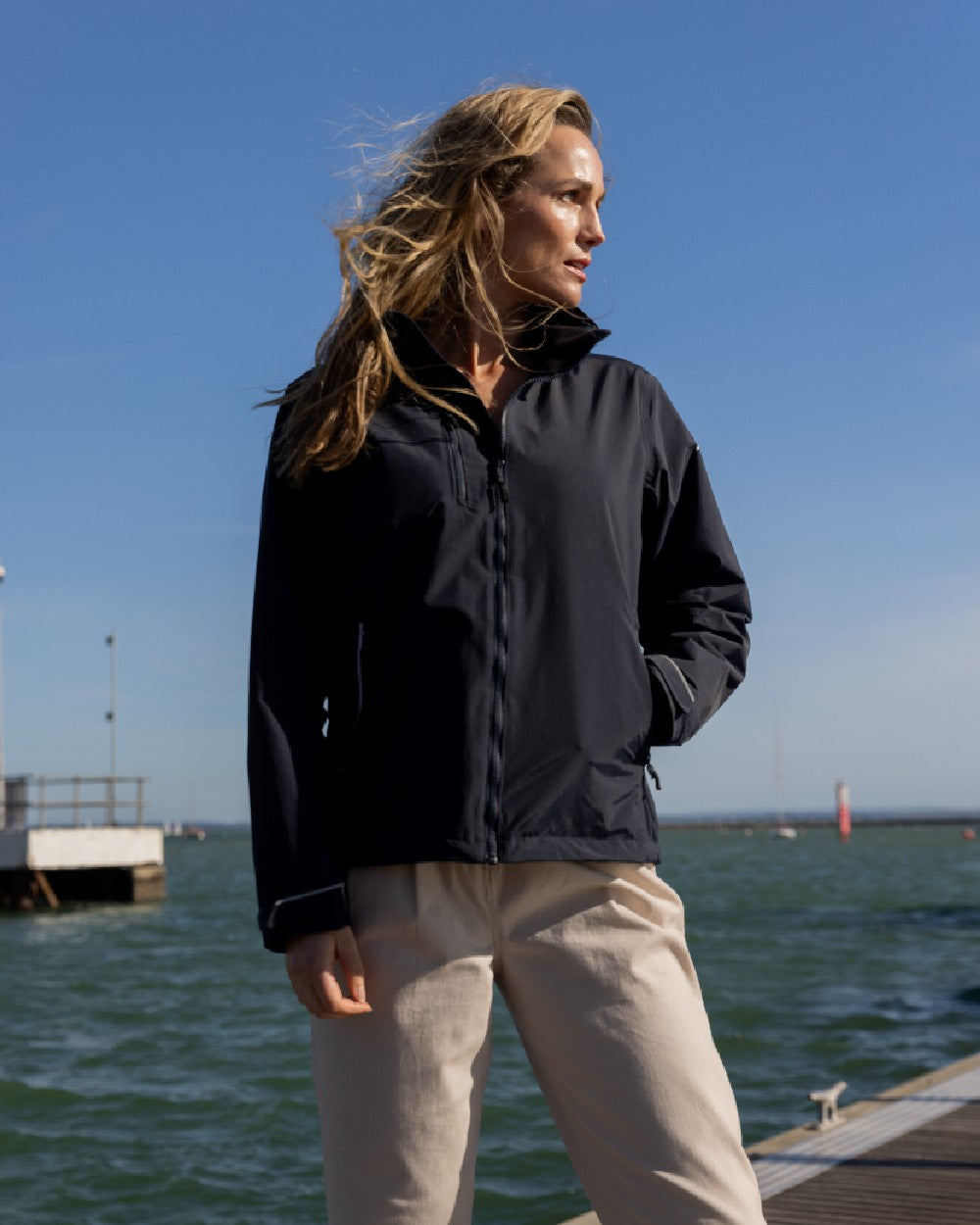 Black Coloured Musto Womens Sardinia Jacket on Beach Background
