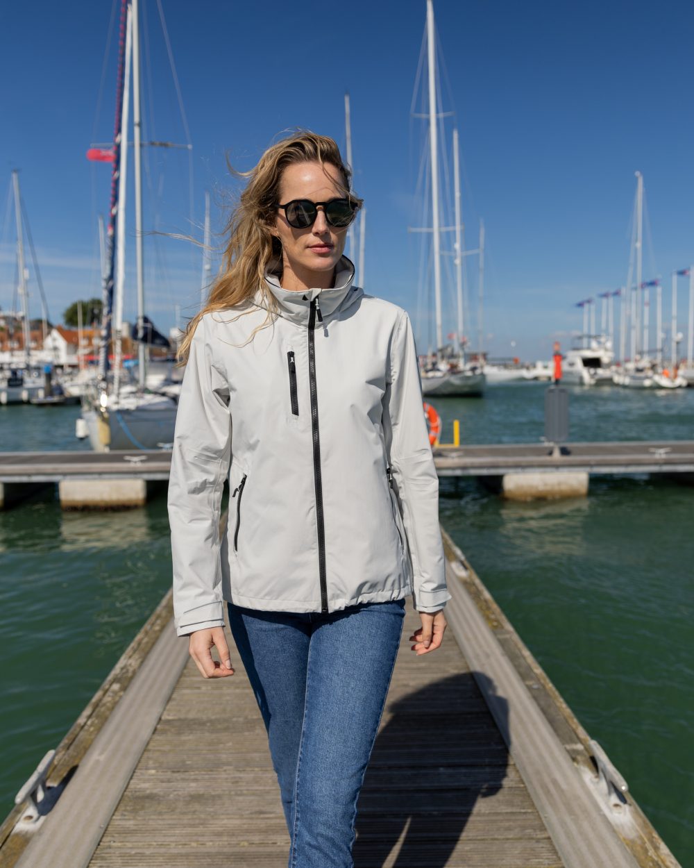 Platinum Coloured Musto Womens Sardinia Jacket on Beach Background
