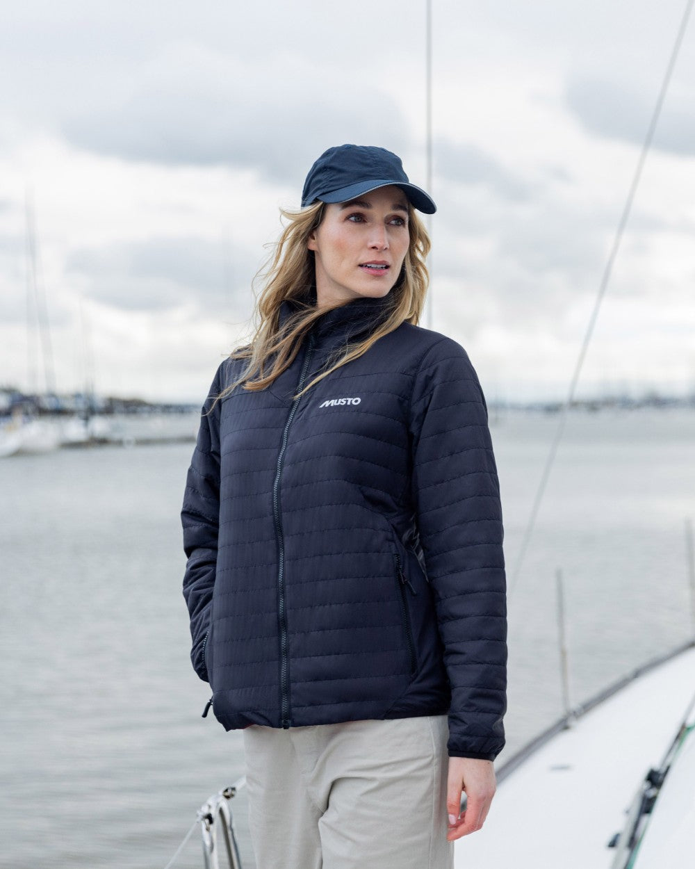 True Navy Coloured Musto Womens Solent Primaloft Insulator on Beach Background
