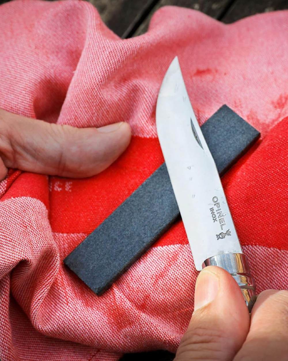 Opinel Sharpening Stone On A Forest Background