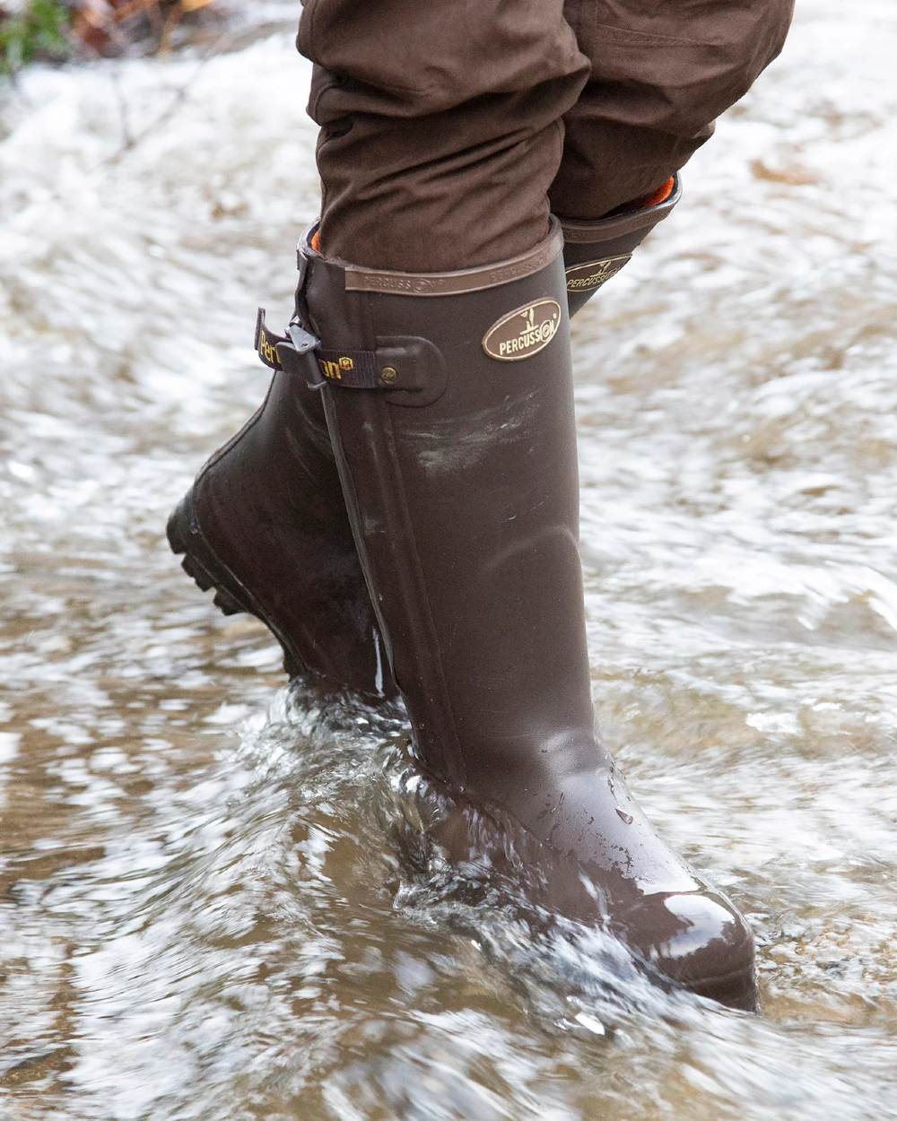 Brown Coloured Percussion Rambouillet Full Zip Boots On A Stream Background