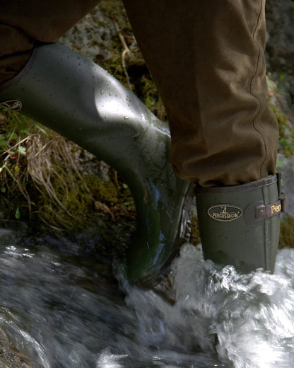 Khaki Coloured Percussion Sologne Rubber Neoprene Wellington Boots On A Forest Background