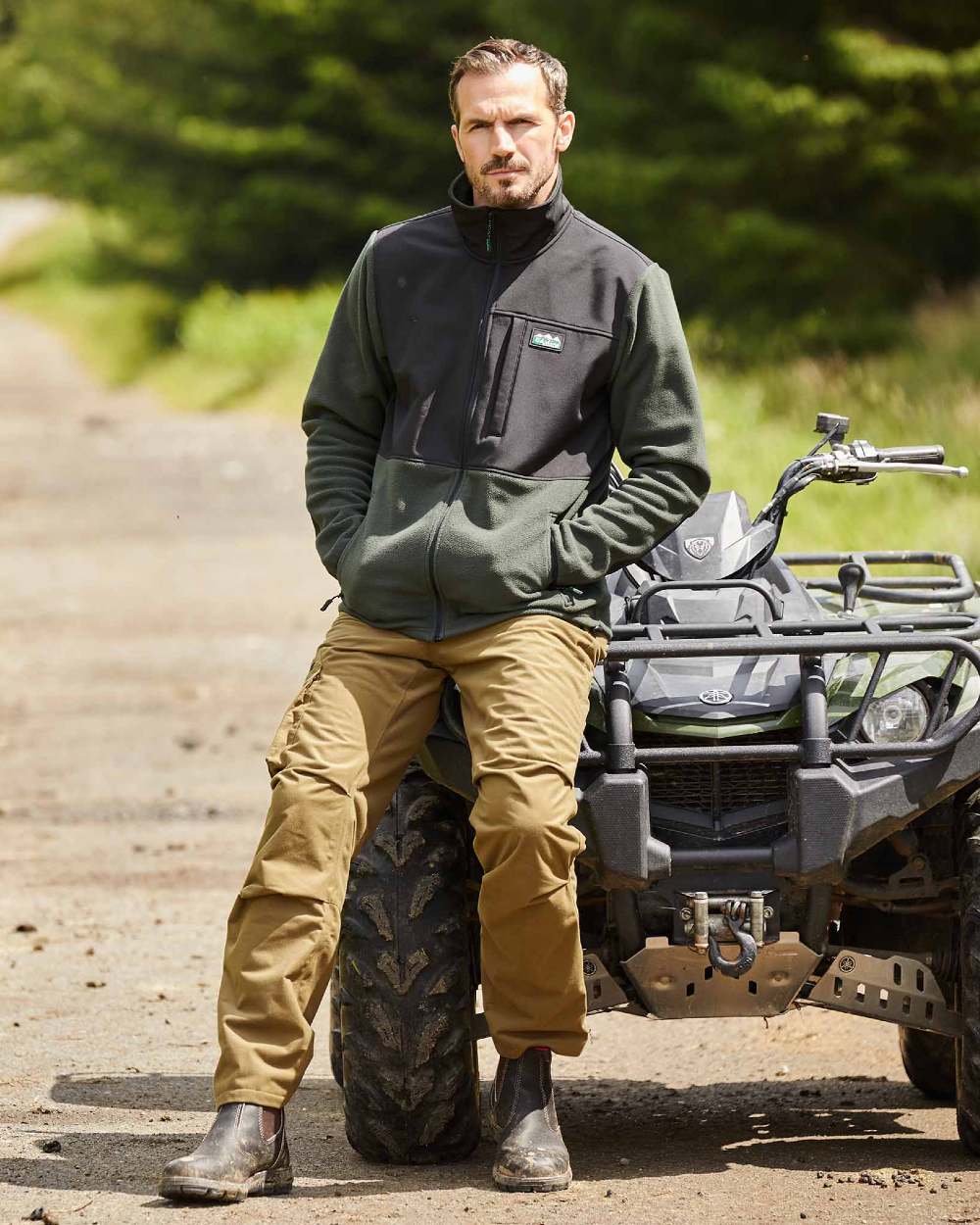 Olive Coloured Ridgeline Hybrid Fleece Jacket On A Road Background 