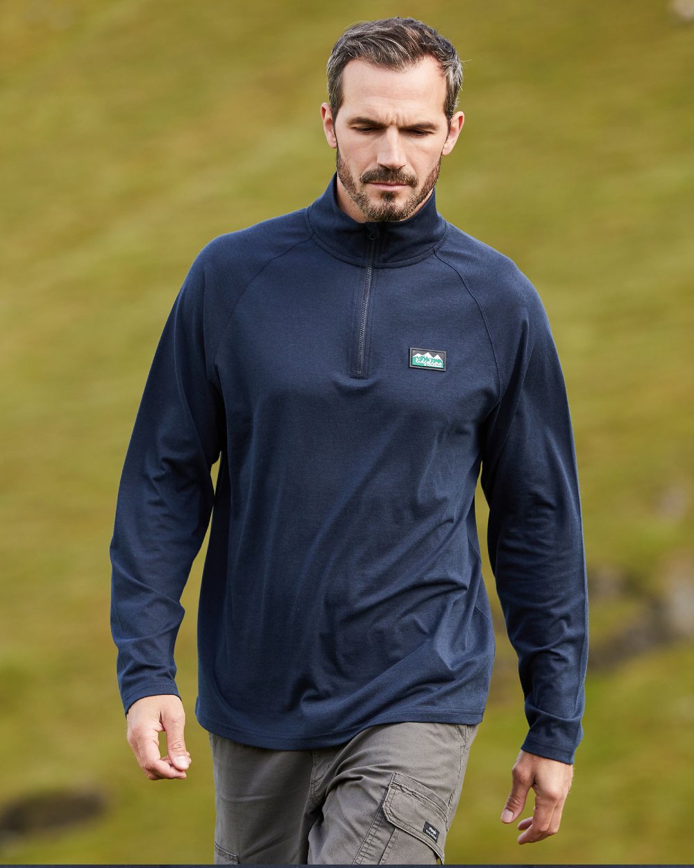 Navy Marl Coloured Ridgeline Mens Baseline Pull on Zip Top On A Field Background 