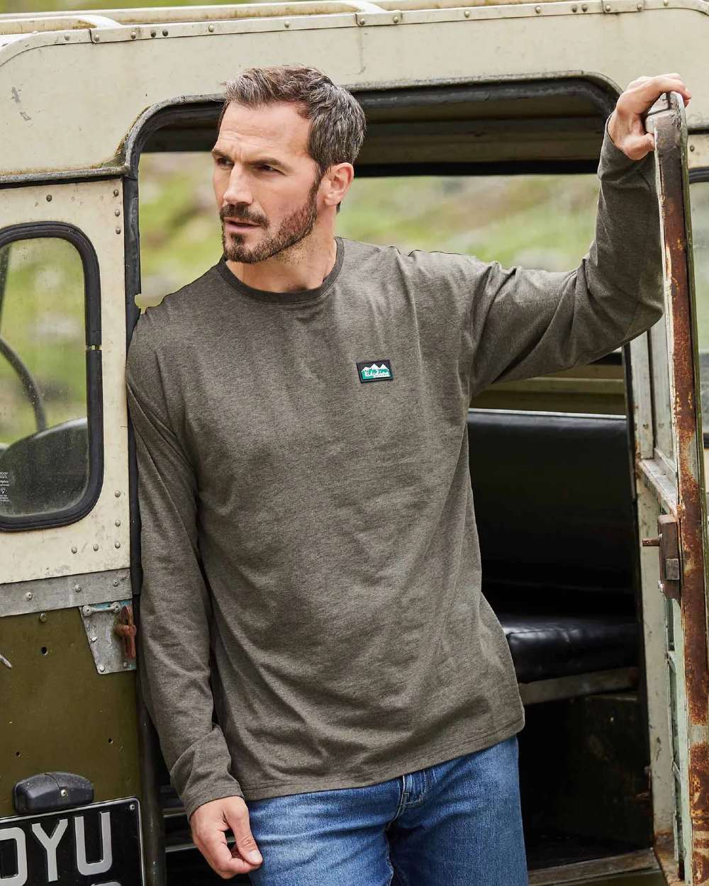 Smokey Olive Marl Coloured Ridgeline Mens Baseline Top On A Field Background 