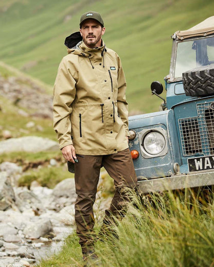 Faded Teak Coloured Ridgeline Mens Monsoon Nunatak Jacket On A Hills Background