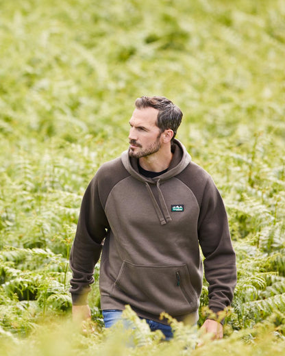 Light Bark Coloured Ridgeline Mens North Island Hoodie On A Forest Background 