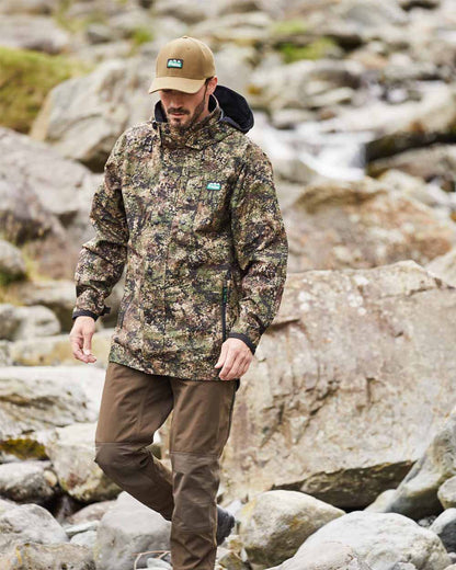 Dirt Camo coloured Ridgeline Monsoon Classic Jacket on Rocky background 