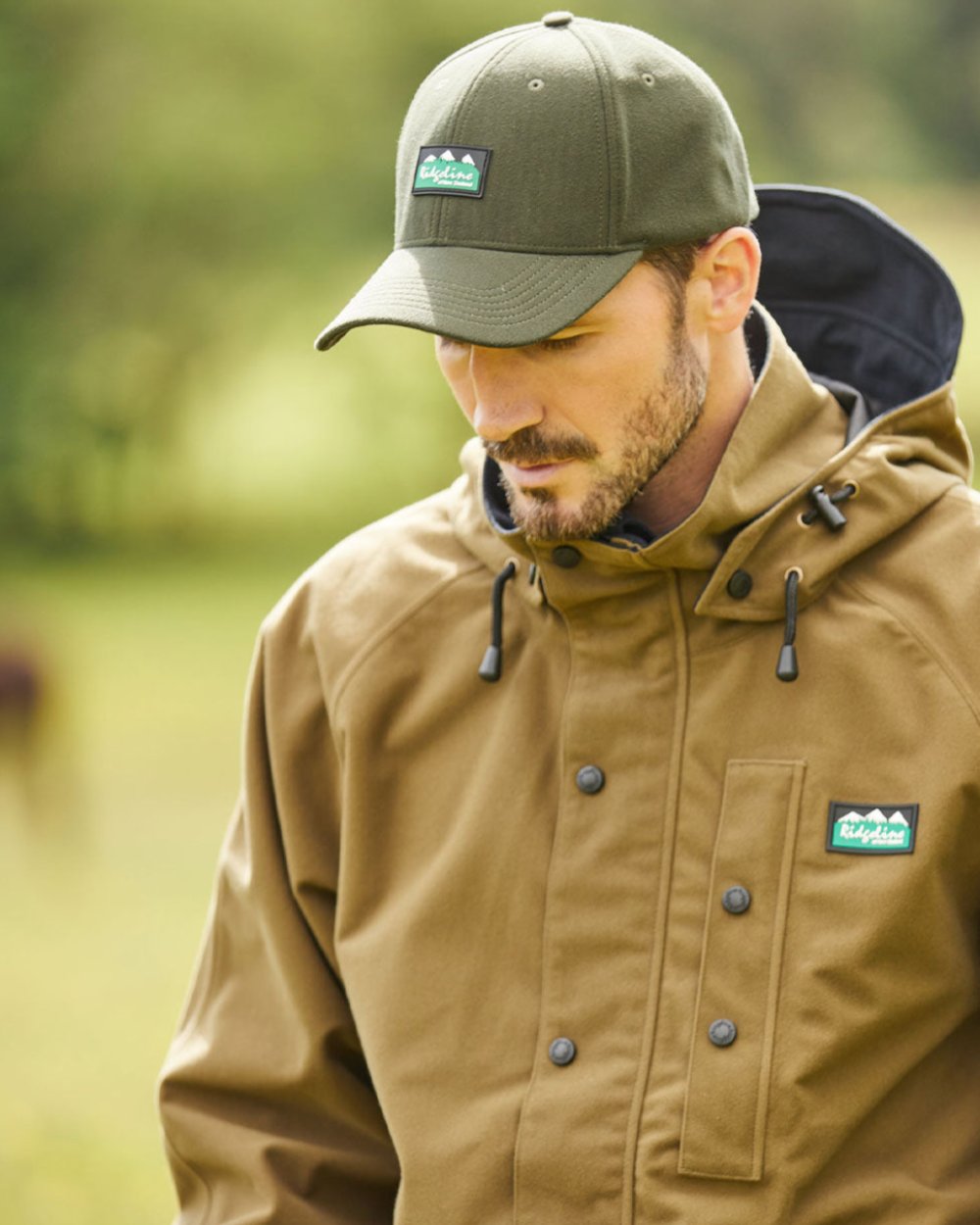 Teak coloured Ridgeline Monsoon Classic Jacket on Forest background 