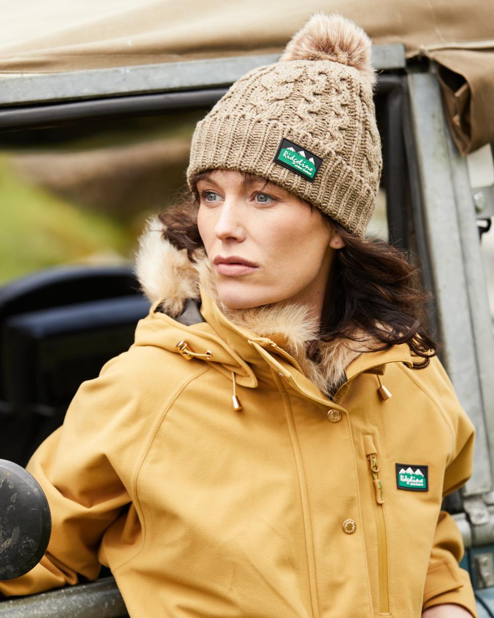 Teak Coloured Ridgeline Nordic Fleck Bobble Hat on outdoor background 