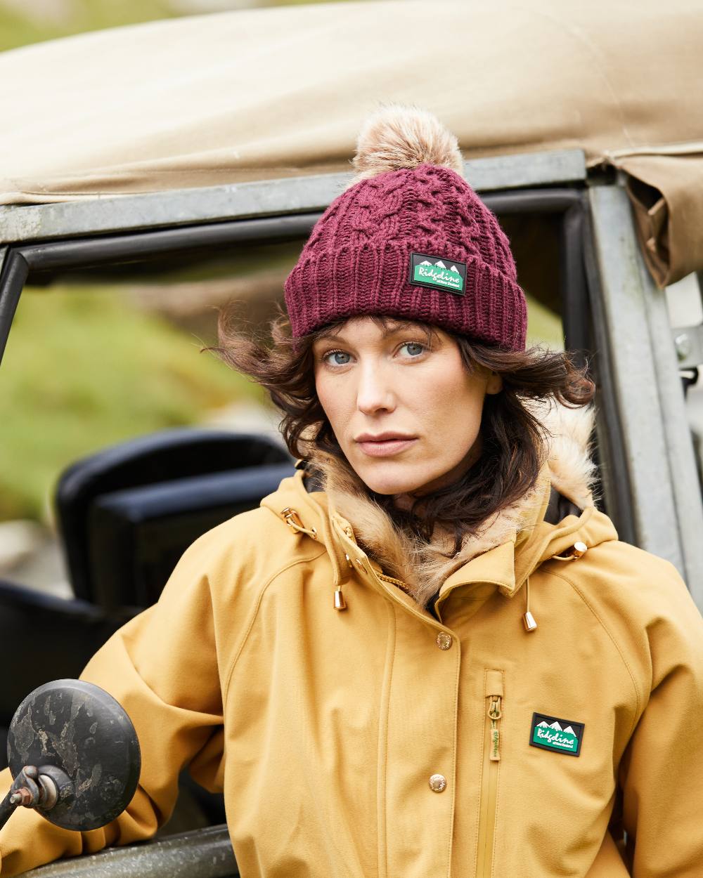 Winter Berry Coloured Ridgeline Nordic Fleck Bobble Hat on outdoor background 