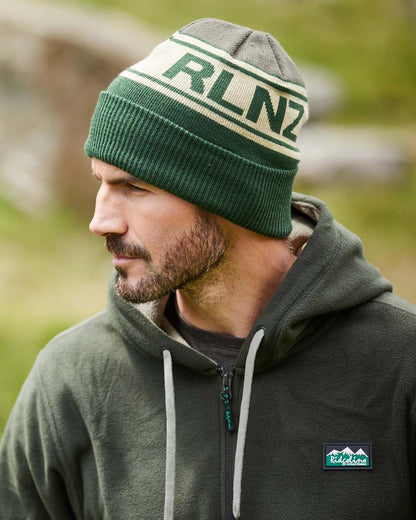 Olive Multi Coloured Ridgeline RLNZ Knitted Beanie On A Blurry Background 