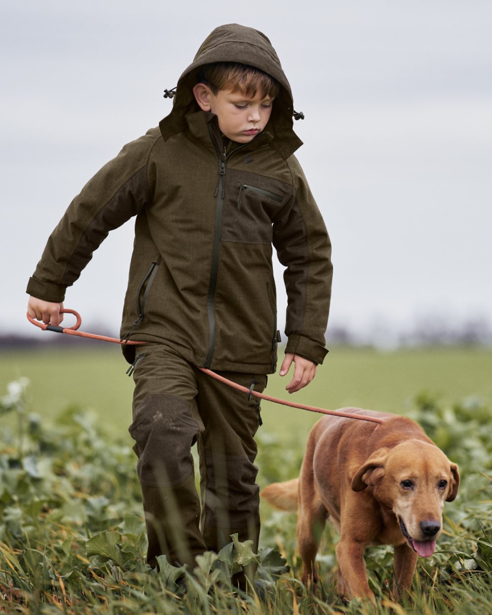 Pine Green Melange Coloured Seeland Childrens Avail Jacket On A Forest Background