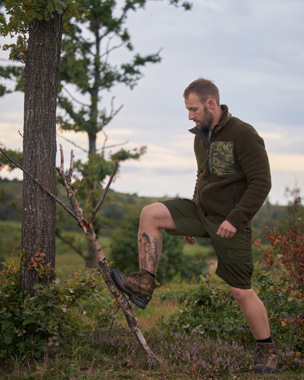 Light Pine Grizzly Brown Coloured Seeland Elm Shorts On A Forest Background