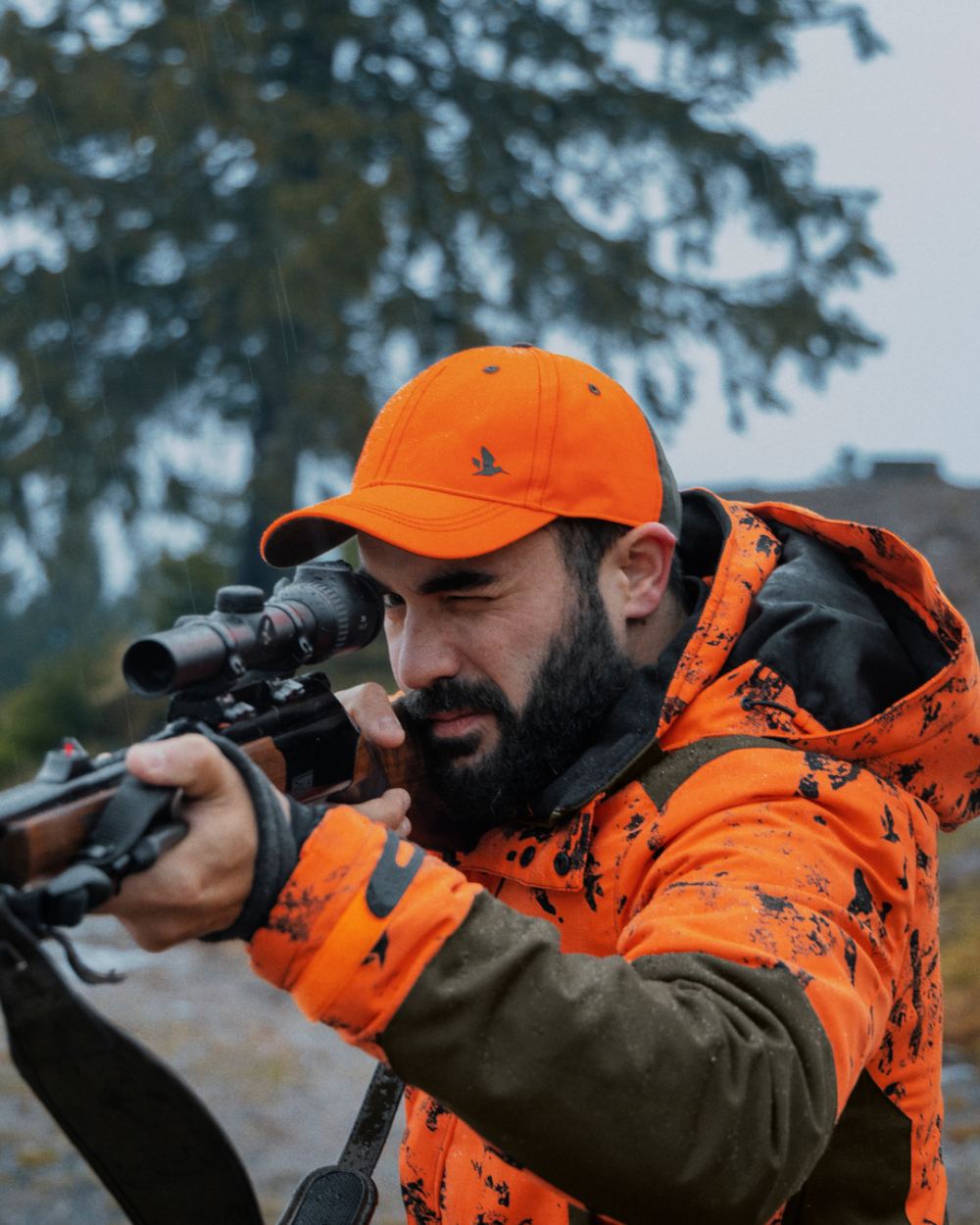 InVis Orange Blaze Coloured Seeland Helt Shield Jacket On A Forest Background