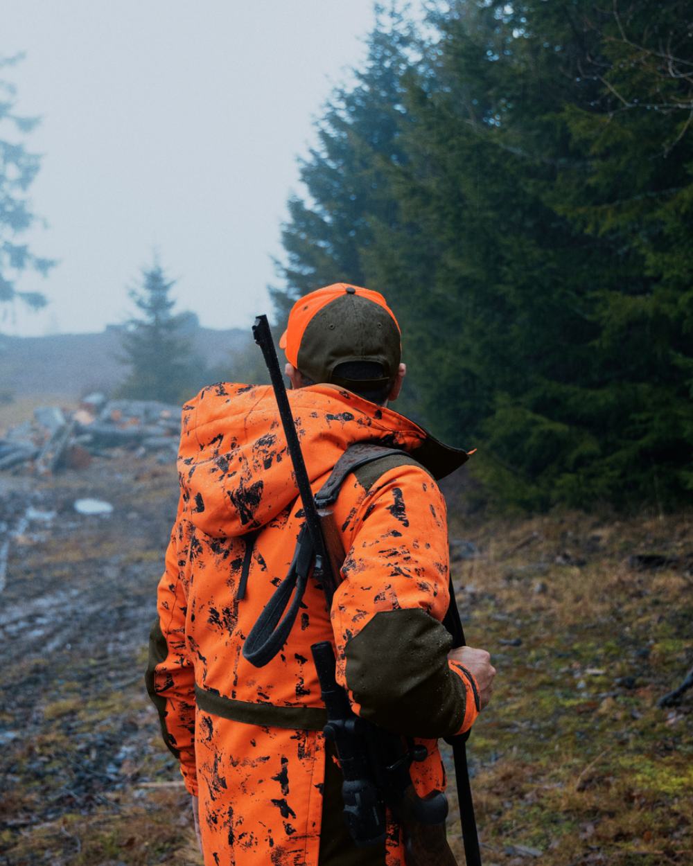 InVis Orange Blaze Coloured Seeland Helt Shield Jacket On A Forest Background