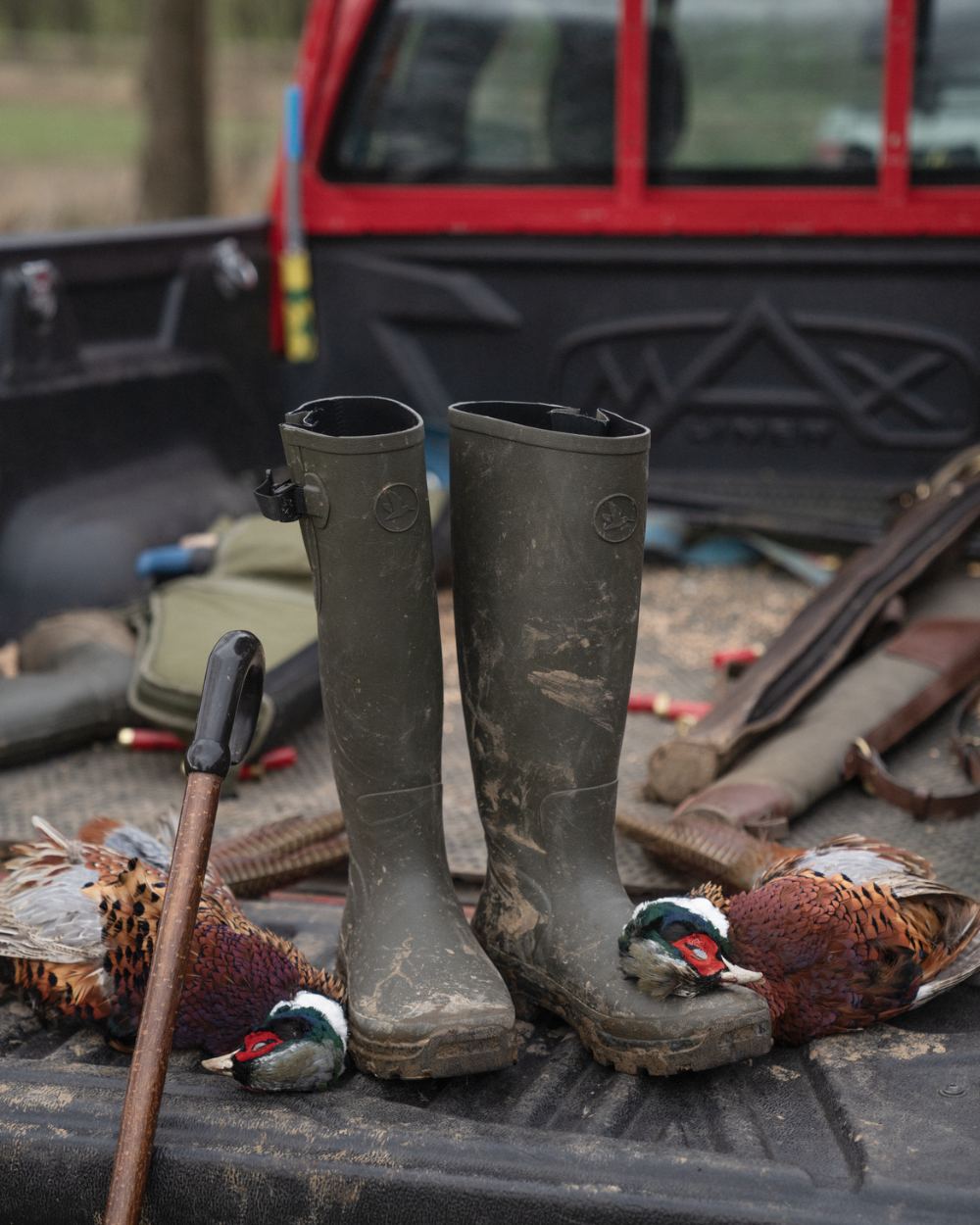 Pine Green Coloured Seeland Hillside Enforced Wellingtons On A Truck Bed Background