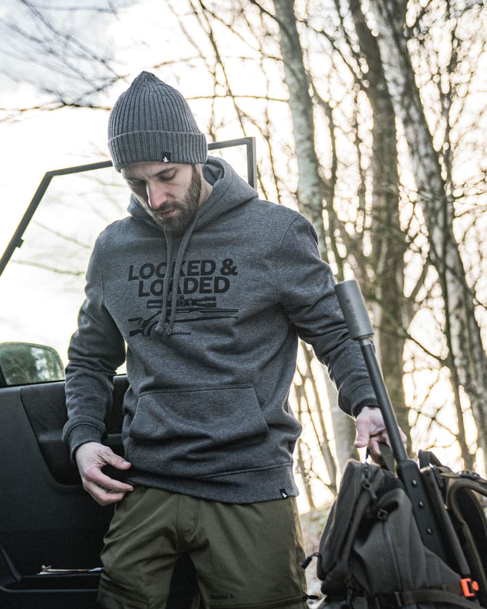 Grey Melange Coloured Seeland Loaded Hoodie On A Forest Background