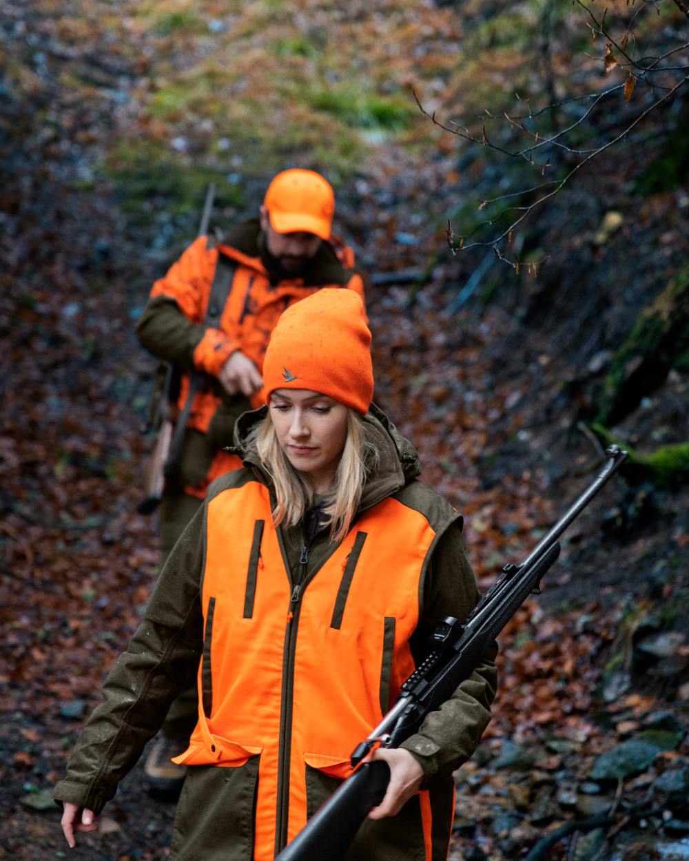 Hi-Vis Orange Coloured Seeland Travo Waistcoat On A Forest Background