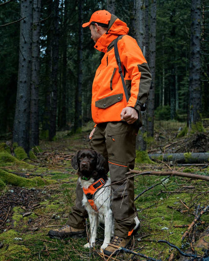 Pine Green/Hi-Vis Orange Coloured Seeland Venture Rover Jacket On A Forest Background