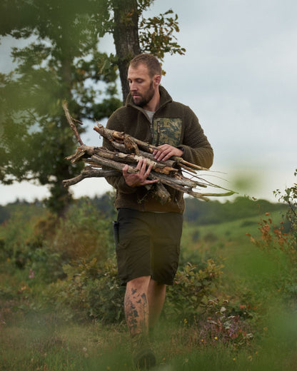 Grizzly Brown Coloured Seeland Zephyr Camo Fleece Jacket On A Forest Background