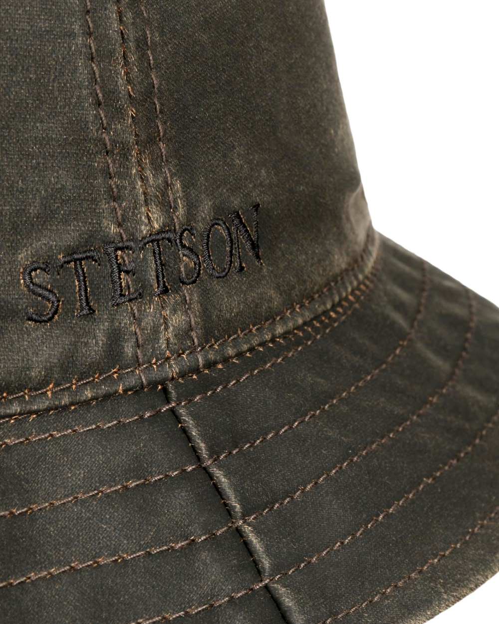 Brown Coloured Stetson Cloth Bucket Hat with Ear Flaps On A White Background