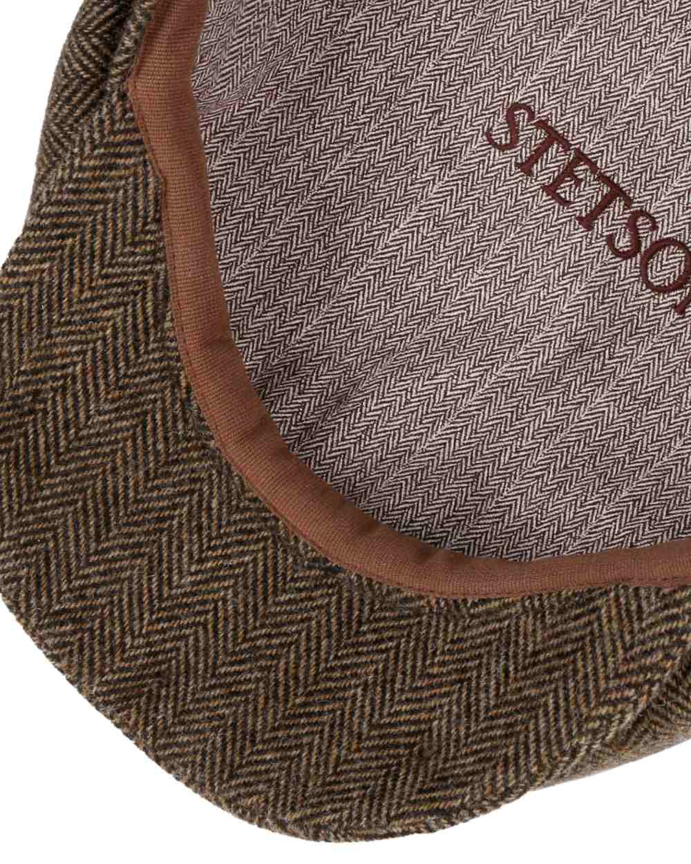 Brown Black Coloured Stetson Hatteras Classic Wool Flat Cap On A White Background 