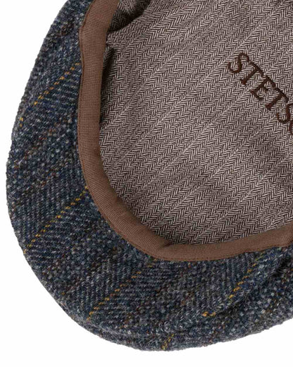 Navy Coloured Stetson Kent Herringbone Stripe Flat Cap On A White Background 