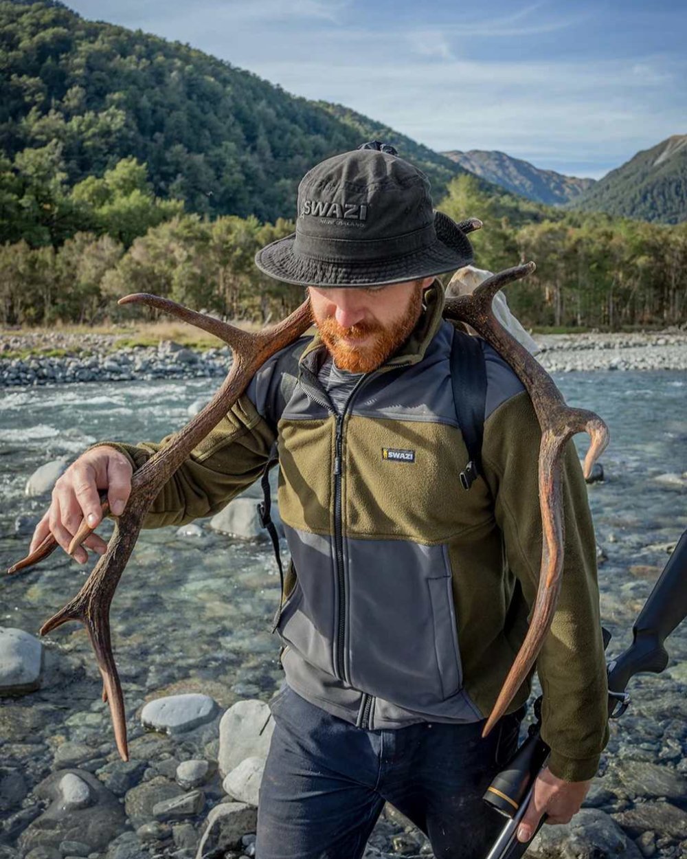 Black Coloured Swazi Bucket Hat On A River Background 