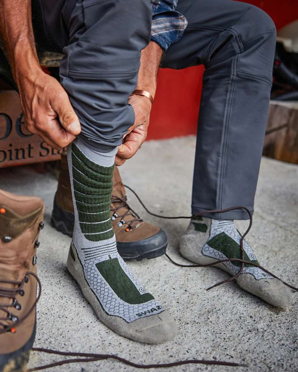 Olive Coloured Swazi The Ibex Socks On A House Background