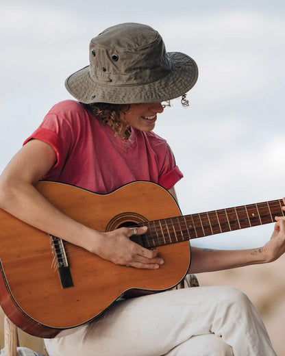 Olive coloured Tilley T3 Wanderer Hat on Dark Sky  background 