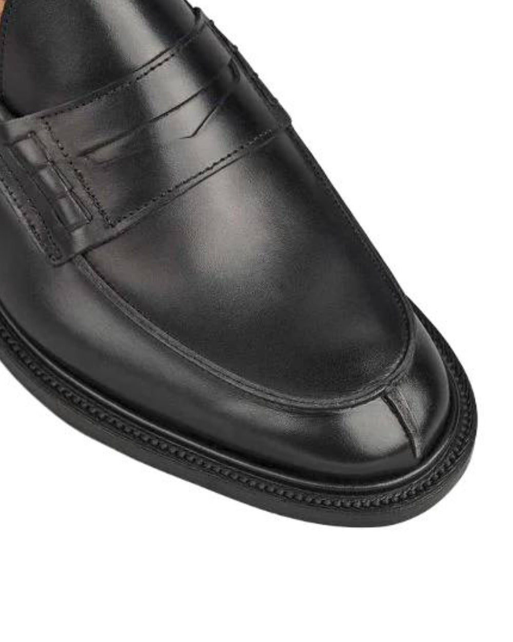 Black Coloured Trickers James Leather Sole Penny Loafer On A White Background 