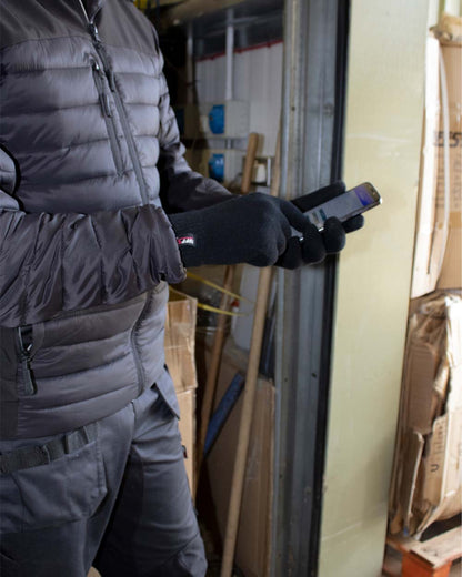 Black coloured TuffStuff Touch Screen Glove on Warehouse Background