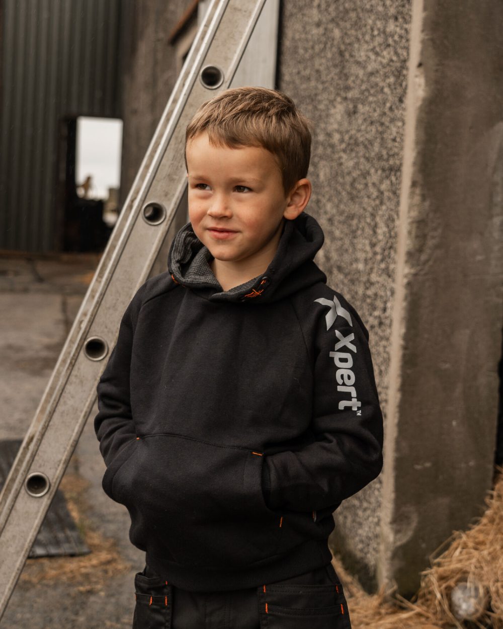 Black Coloured Xpert Childrens Pro Pullover Hoodie on Outdoor Background
