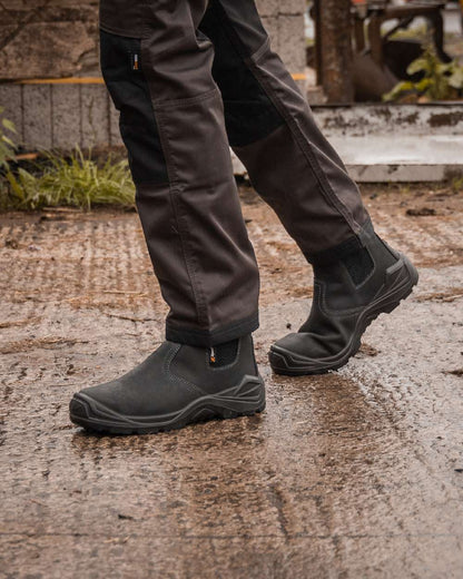 Black Coloured Xpert Mens Defiant S3 Safety Dealer Boots on Outdoor Background
