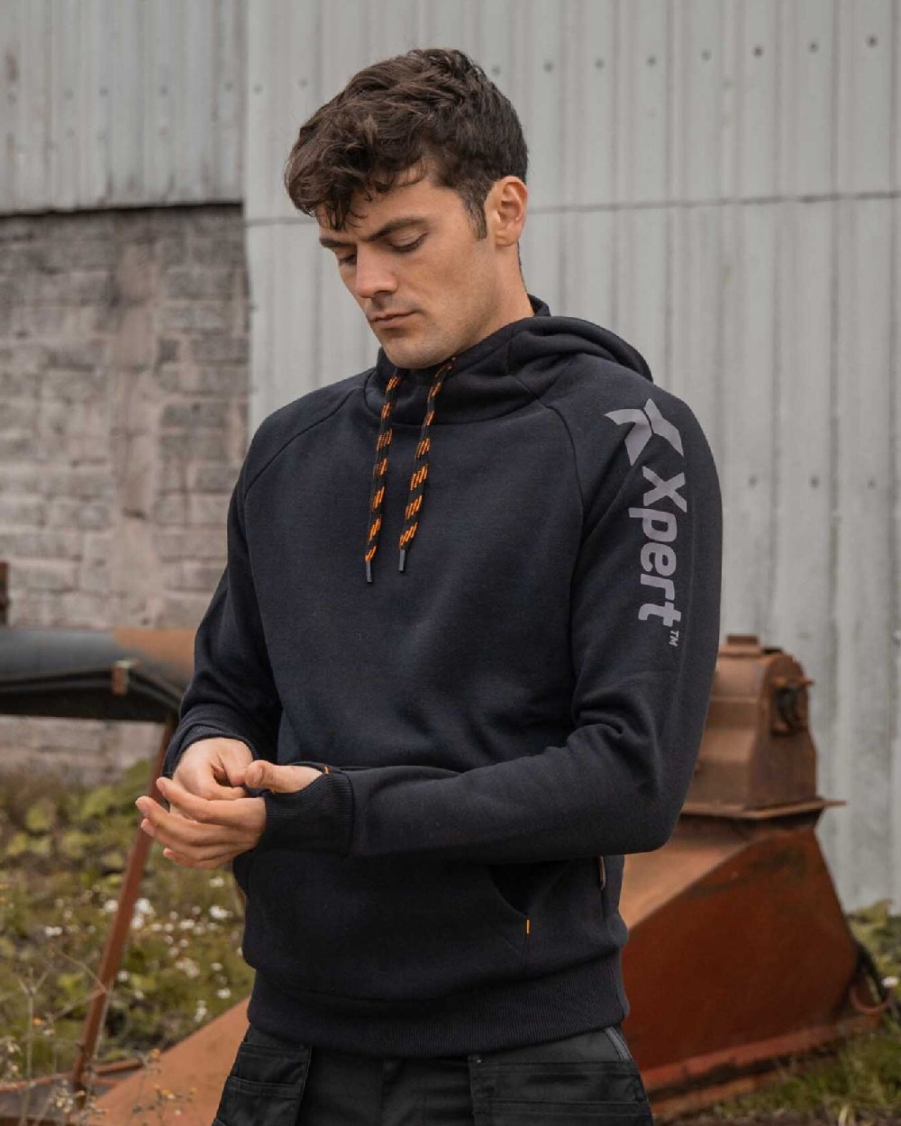 Black Coloured pert Mens Pro Pullover Hoodieon Outdoor Background
