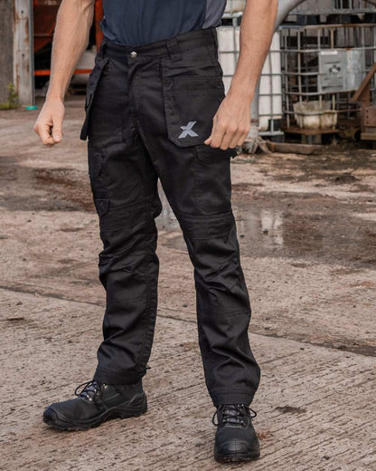 Black Coloured Xpert Mens Pro Stretch Work Trousers on Outdoor Background
