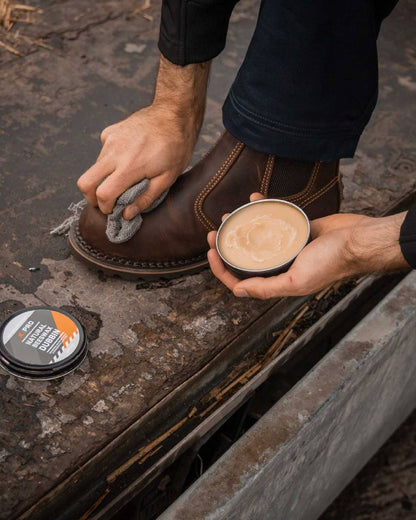 Neutral Coloured Xpert Pro-Wax Natural Beeswax Boots Dubbin on Outdoor Background
