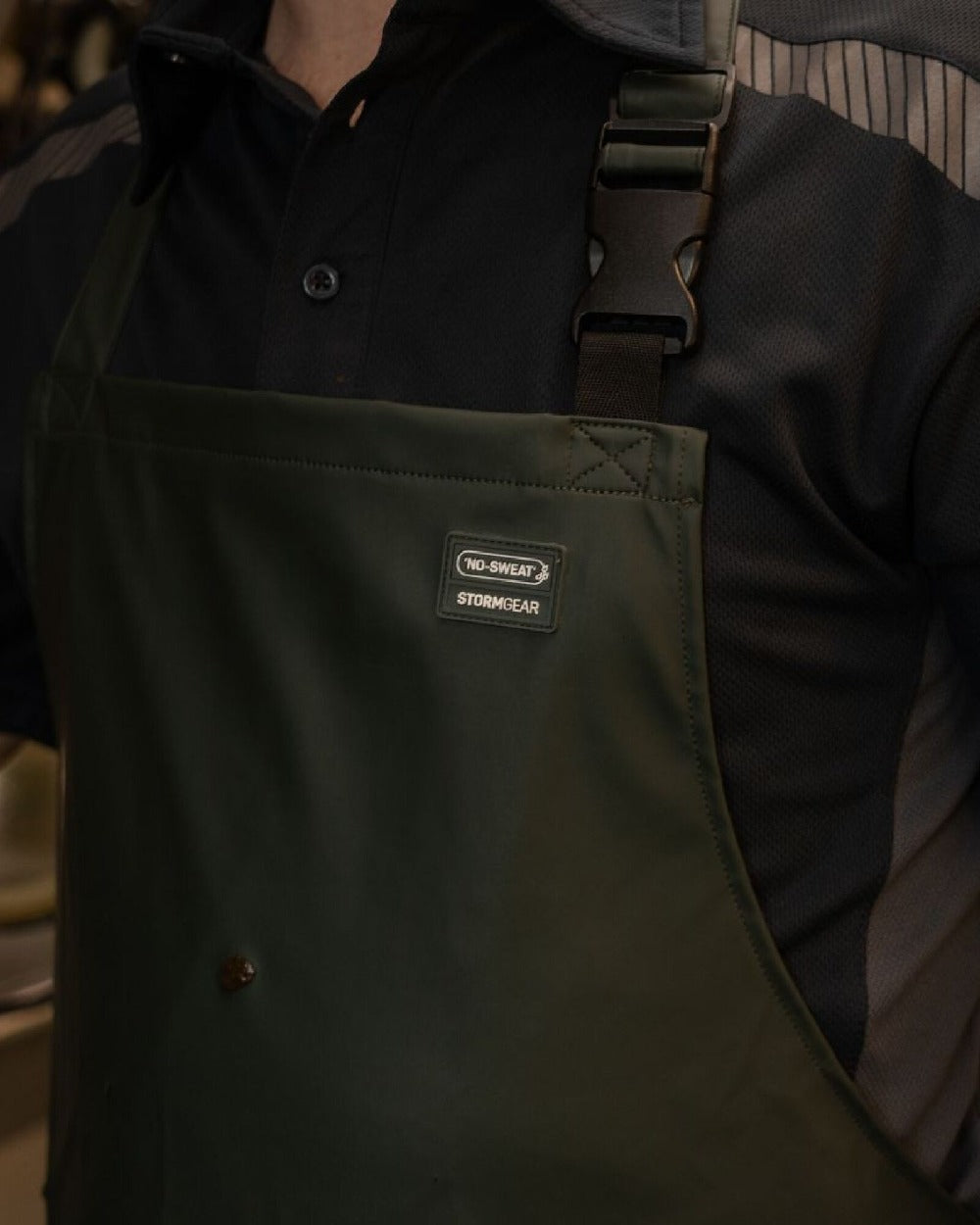 Green Coloured Xpert Swampmaster No-Sweat Stormgear Waterproof Dairy Apron on Factory Background
